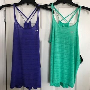 Two Nike running criss cross tank tops